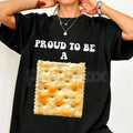 "Proud to Be a Cracker" Funny Holiday T-Shirt - Humorous Christmas Party Costume Tee, Premium 100% Cotton Sarcastic Pun Top, Witty Festive Nutcracker Style Shirt, Unique Holiday Gift for Him & Her, Soft Lived-In Heavyweight Casual Apparel