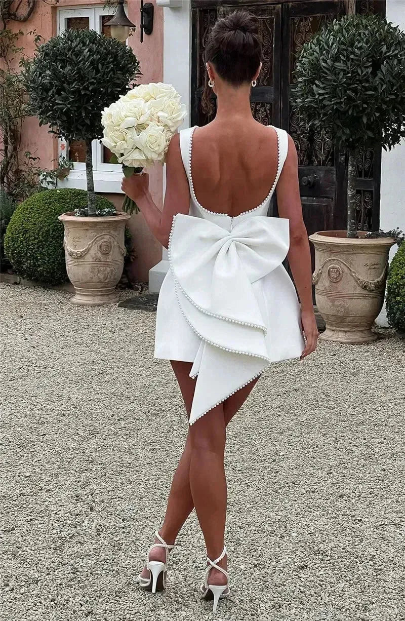 Mozision Pearl Bow Backless Sexy Mini Dress For Women Robe Fashion Zipper Sleeveless High Waist A-line Club Party Dress Elegant