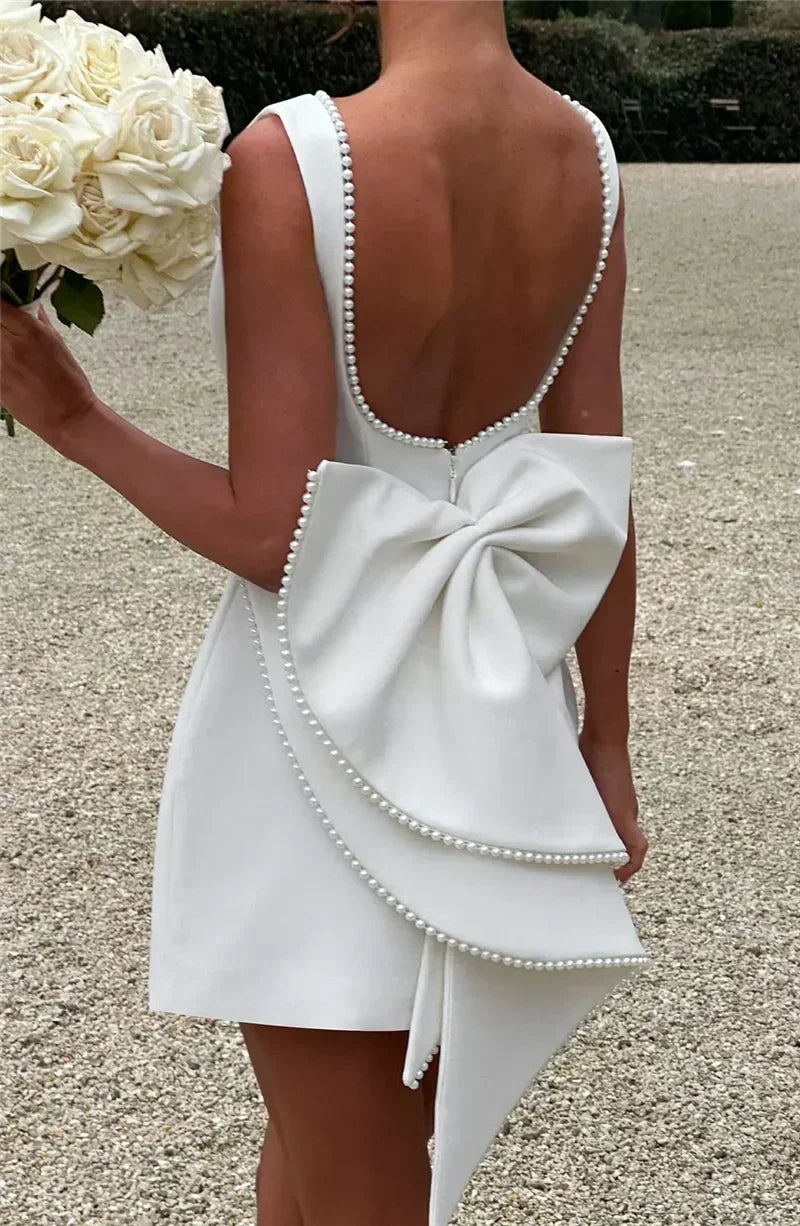 Mozision Pearl Bow Backless Sexy Mini Dress For Women Robe Fashion Zipper Sleeveless High Waist A-line Club Party Dress Elegant